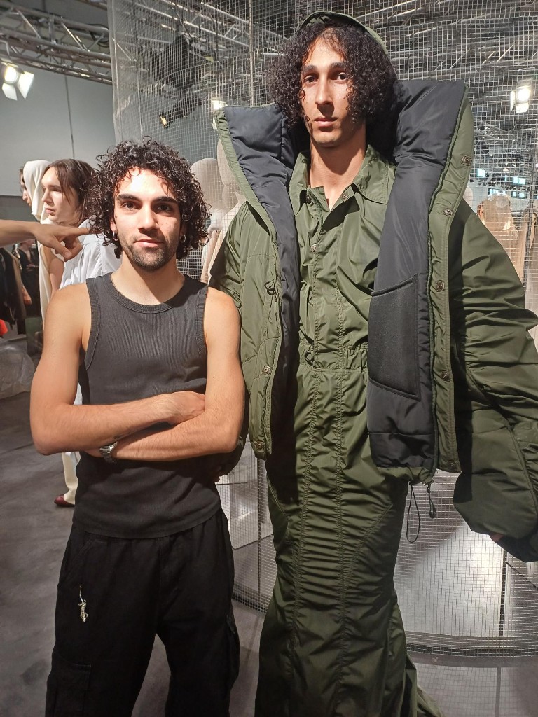 Designers and collaborators at a fashion presentation